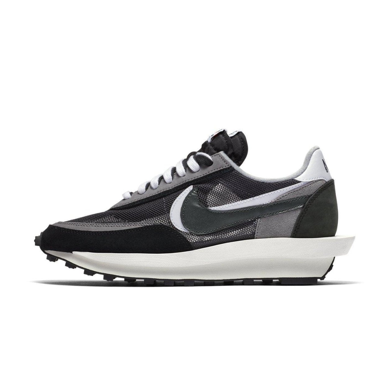 Nike LD Waffle Sacai black sneakers featuring mesh and suede materials, double tongue and co-branded design.