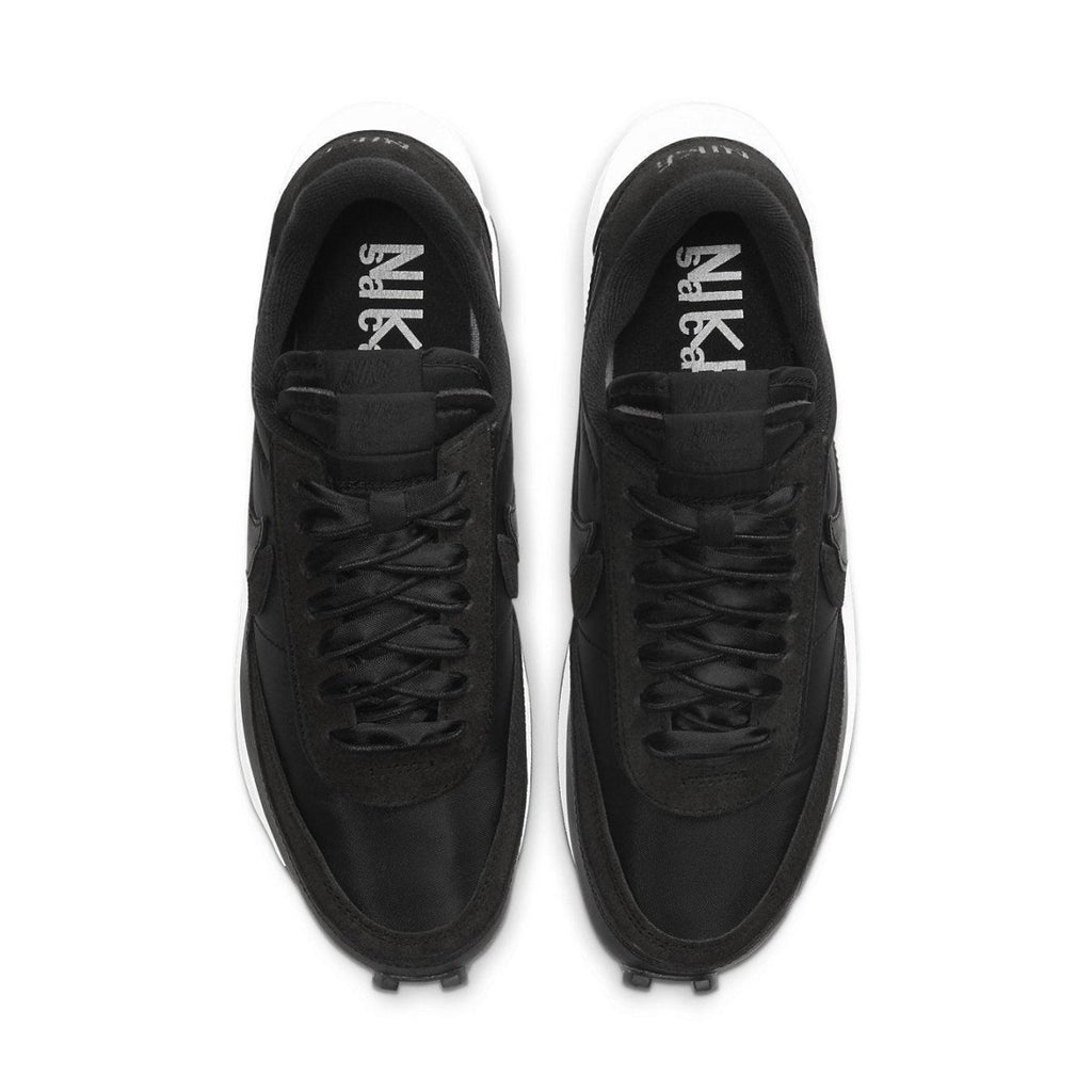 Nike LD Waffle Sacai sneakers in black nylon from above, featuring dual laces and Swoosh branding.