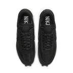 Nike LD Waffle Sacai sneakers in black nylon from above, featuring dual laces and Swoosh branding.