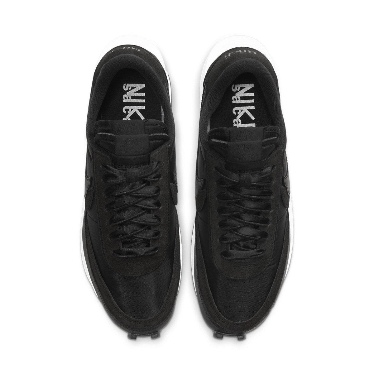 Nike LD Waffle Sacai sneakers in black nylon from above, featuring dual laces and Swoosh branding.