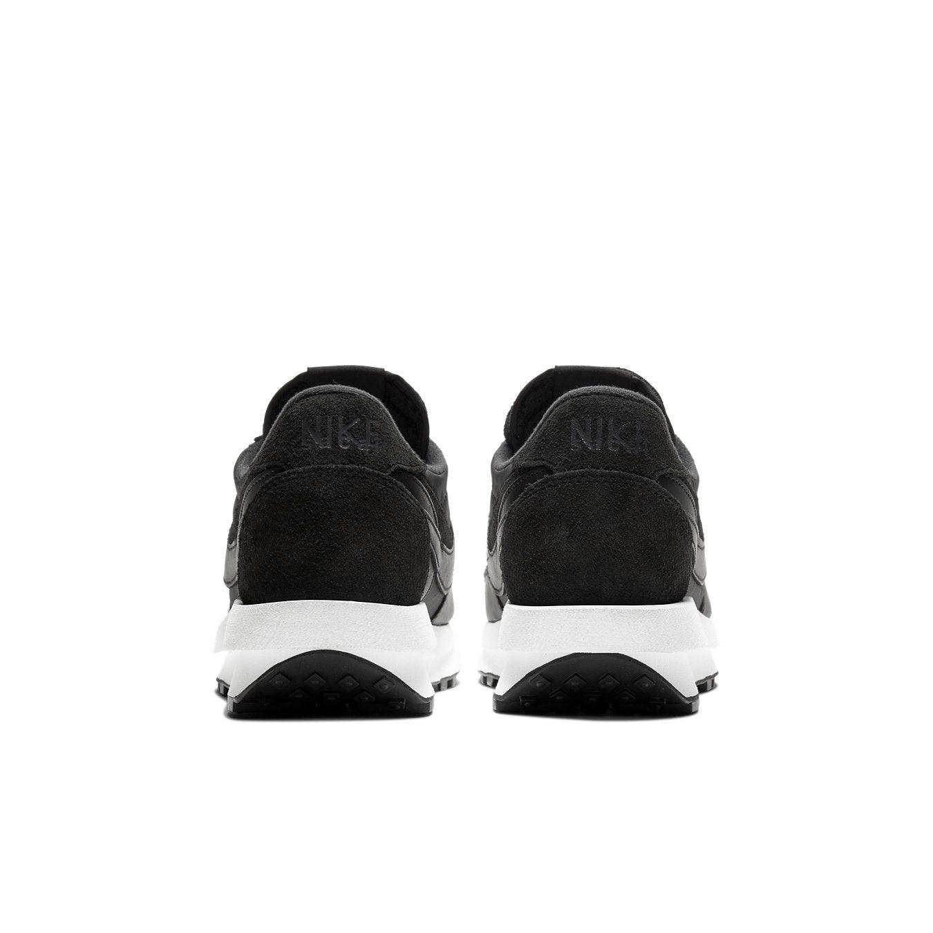 Nike LD Waffle Sacai Black Nylon sneakers rear view with dual branding and sleek black suede design.