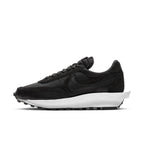 Nike LD Waffle Sacai Black Nylon sneakers in profile view, featuring a sleek black design and white sole.