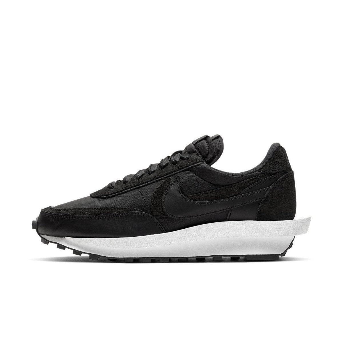 Nike LD Waffle Sacai Black Nylon sneakers in profile view, featuring a sleek black design and white sole.