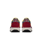 Nike LD Waffle Sacai Blue Multi sneakers in red and yellow, showing the back view with dual Swoosh and unique design elements.