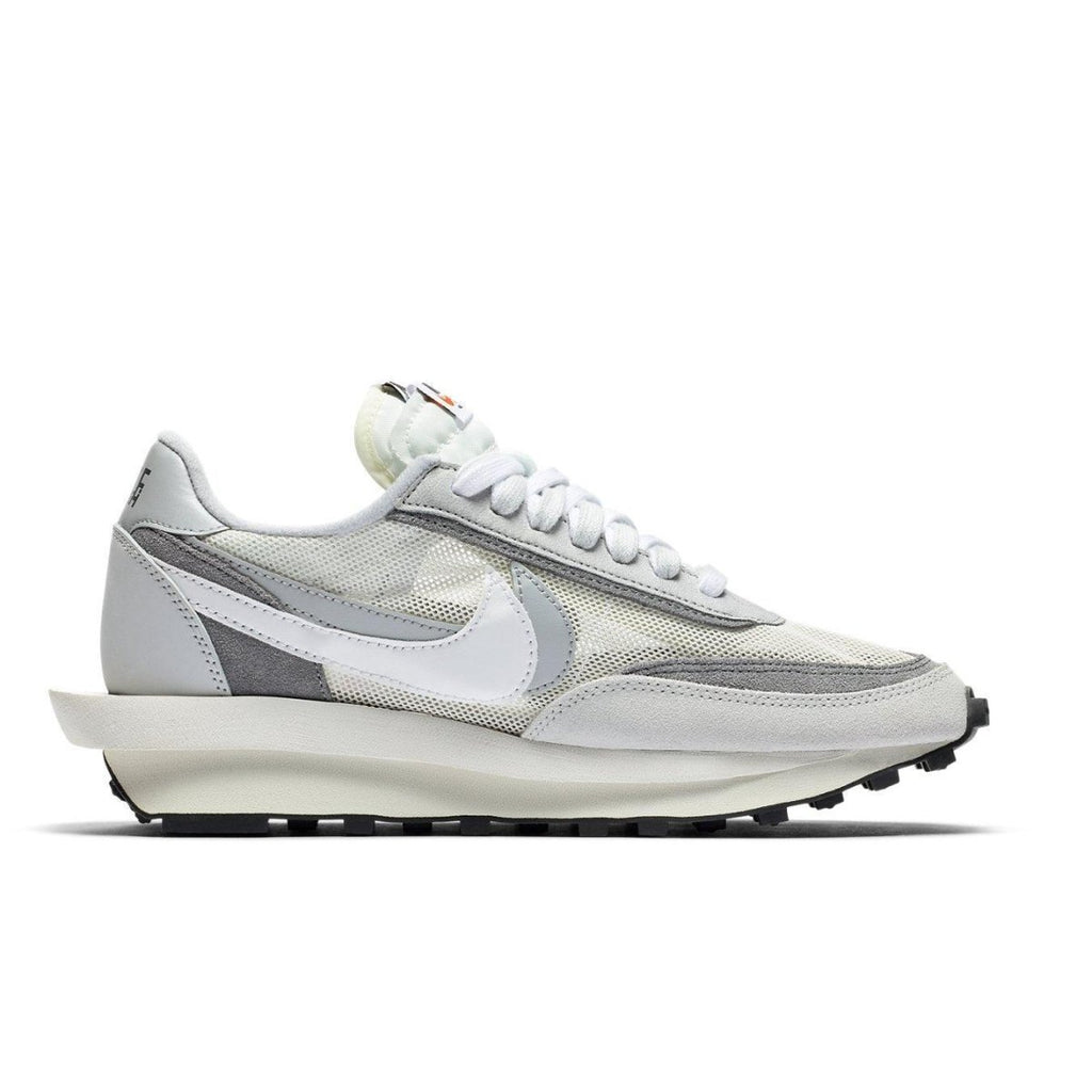 Nike LD Waffle Sacai Summit White sneaker in mesh and leather with dual Swoosh and laces, showcasing hybrid design.