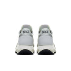 Nike LD Waffle Sacai Summit White sneakers rear view with co-branded Nike and Sacai logo.
