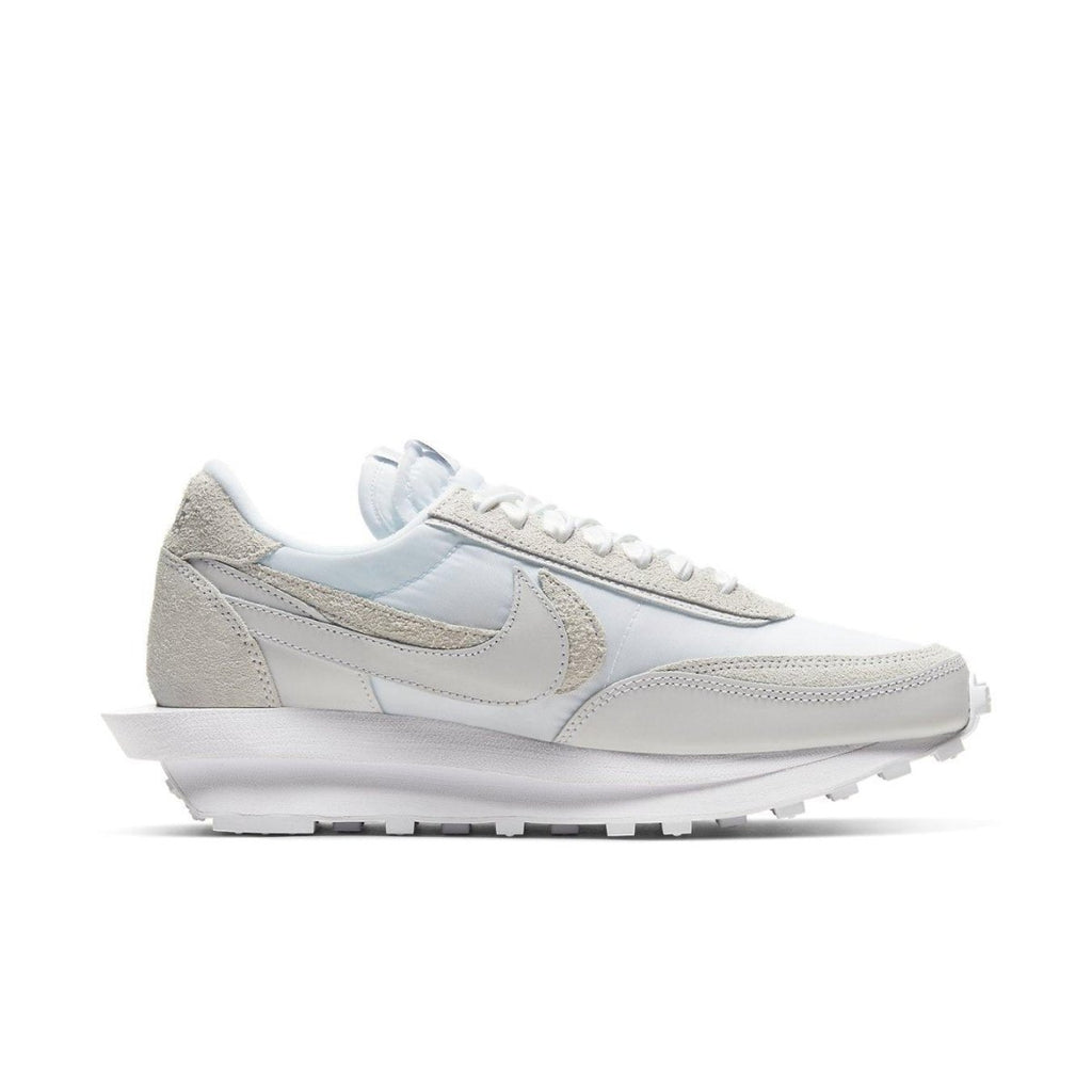 Nike LD Waffle Sacai sneakers in white nylon, featuring dual theme design and co-branded emblem with Sacai.