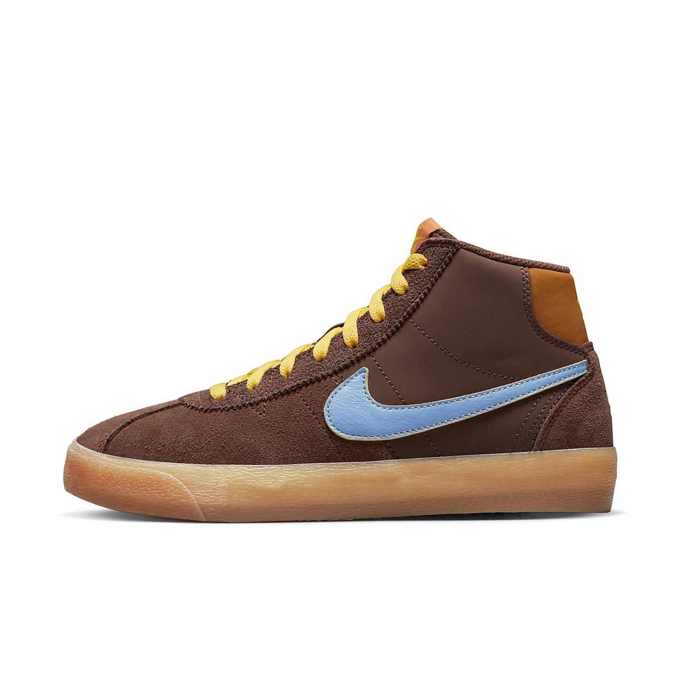 Nike SB Bruin High Why So Sad? women’s sneaker in brown suede with yellow laces and blue Swoosh.