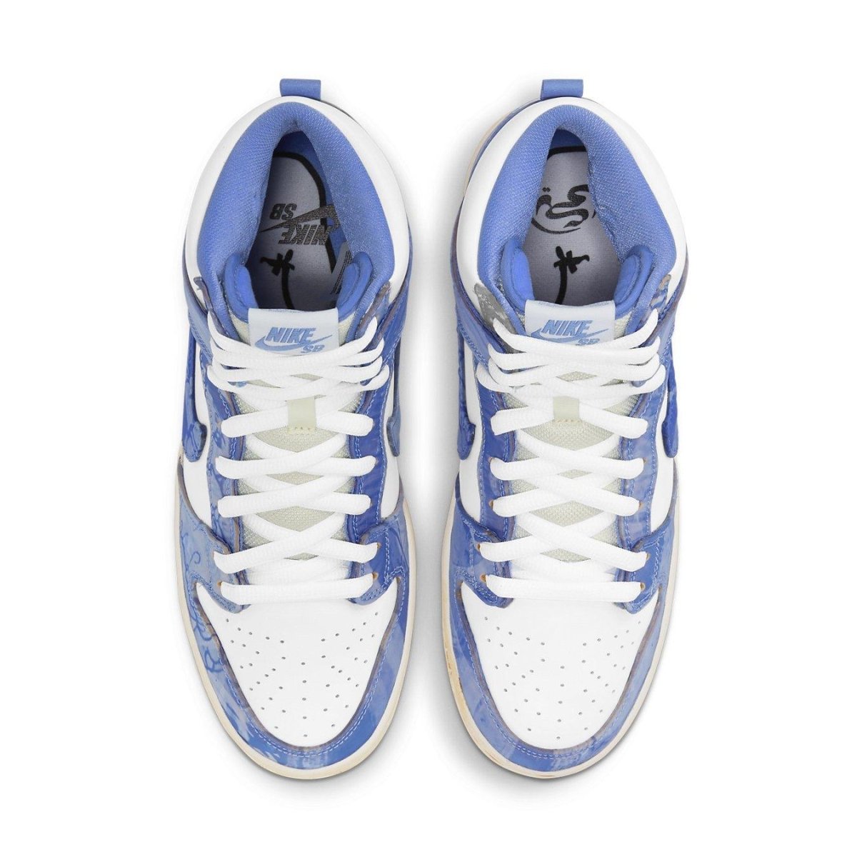 Top view of Nike SB Dunk High Carpet Company sneakers featuring blue accents and premium white leather.