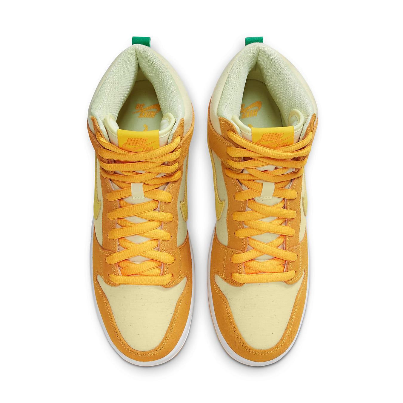 Nike SB Dunk High Pineapple sneakers in pale yellow and golden suede with vibrant yellow Swoosh.