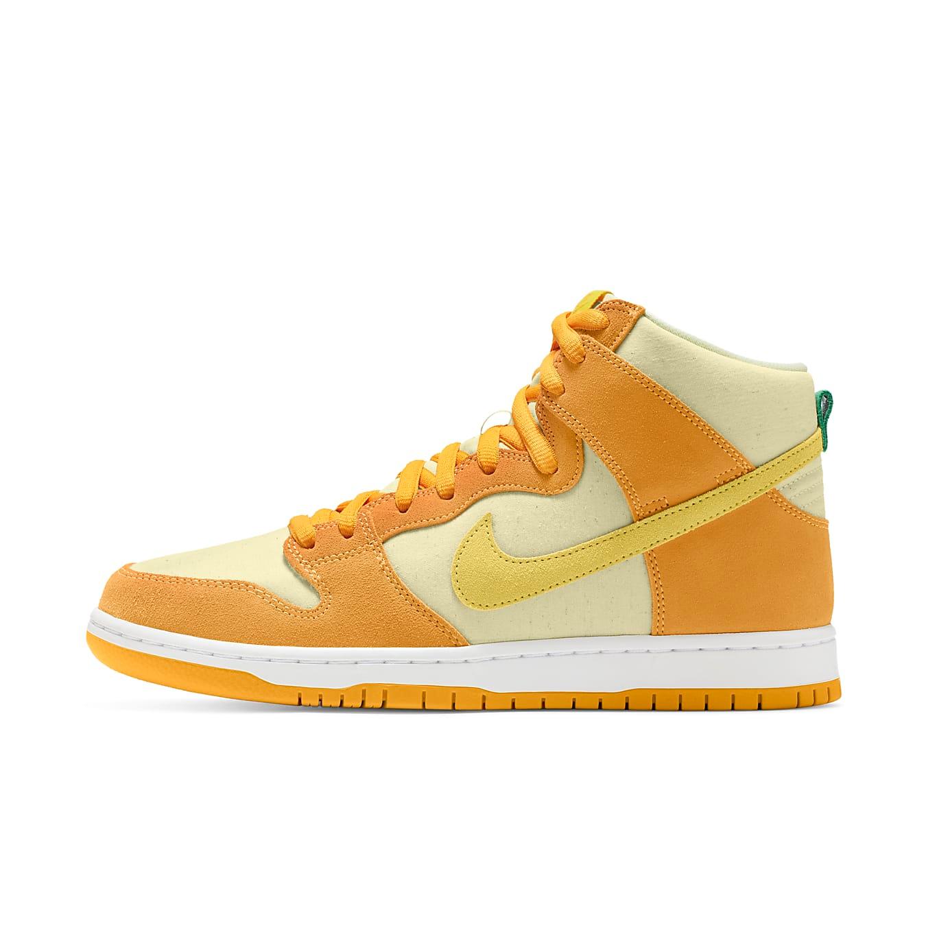 Nike SB Dunk High 'Pineapple' sneakers in pale yellow and orange colorway with suede and leather materials.