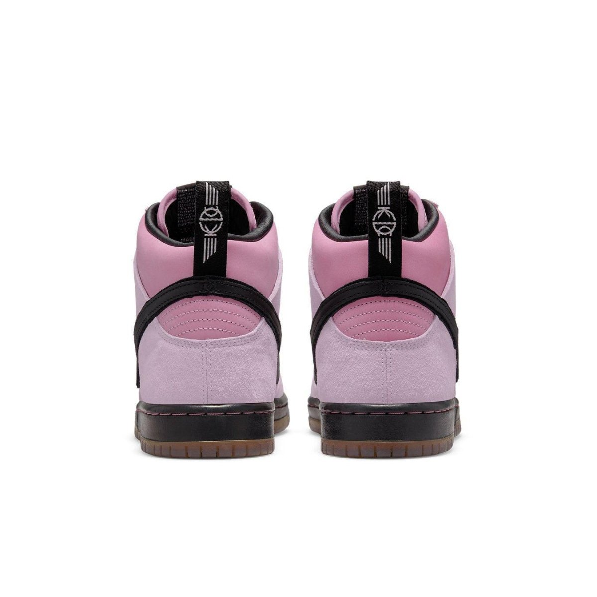 Nike SB Dunk High Pro KCDC in pink suede, featuring a black strap and gum sole, showcasing the back view.