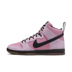 Nike SB Dunk High Pro KCDC in pink suede with black Swoosh and laces, side view.