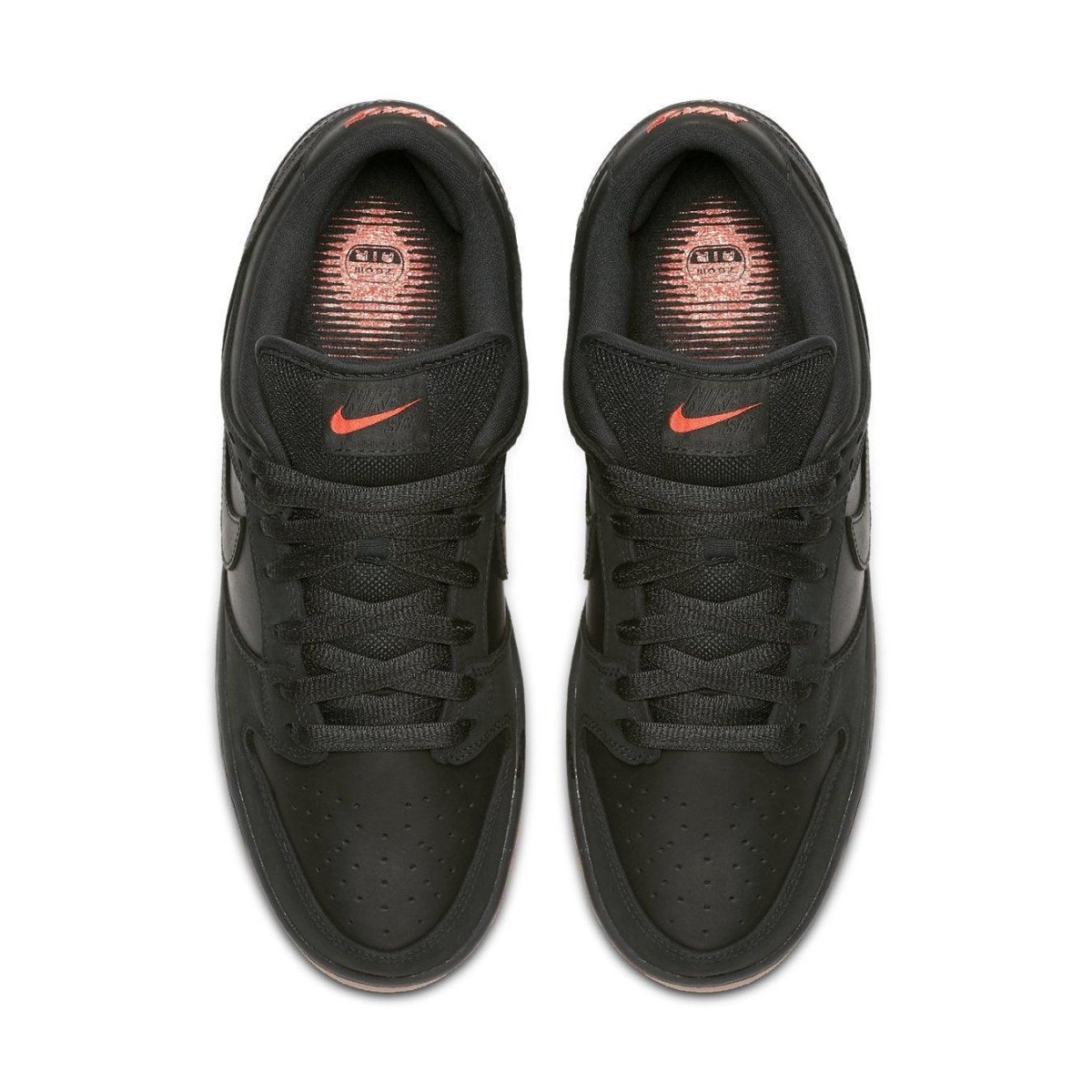 Nike SB Dunk Low Black Pigeon sneakers from above, featuring black leather and subtle orange accents.