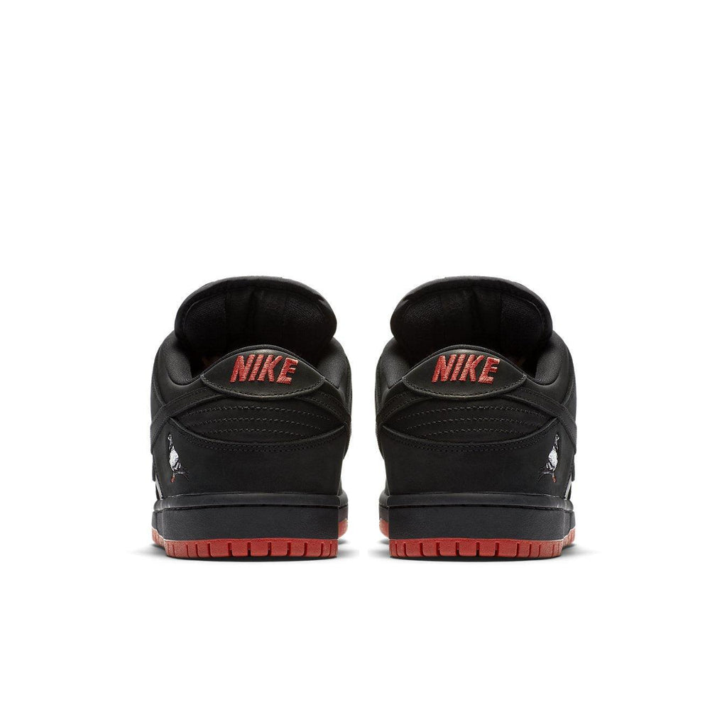Nike SB Dunk Low Black Pigeon sneaker rear view showcasing black and red design details.
