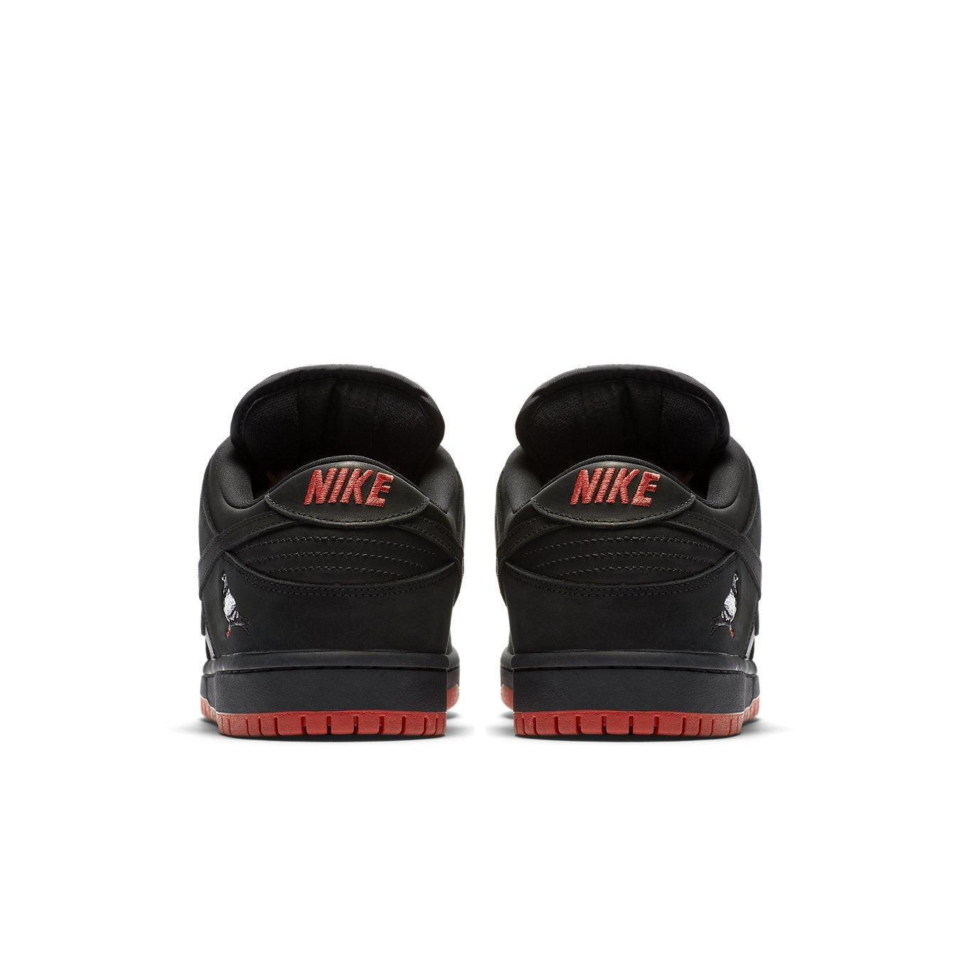 Nike SB Dunk Low Black Pigeon sneaker rear view showcasing black and red design details.