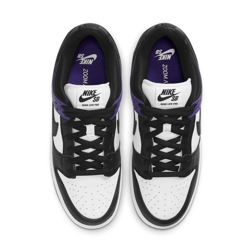 Nike SB Dunk Low Court Purple sneakers in black, white, and purple with Zoom Air cushioning and padded tongue.