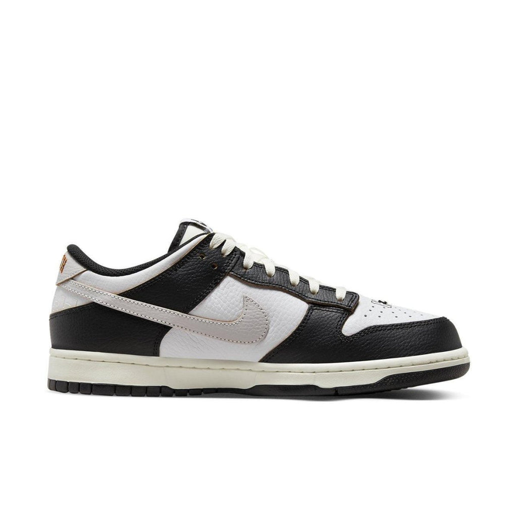 Nike SB Dunk Low HUF San Francisco sneaker in black, white, and tan colorway with iconic design elements.
