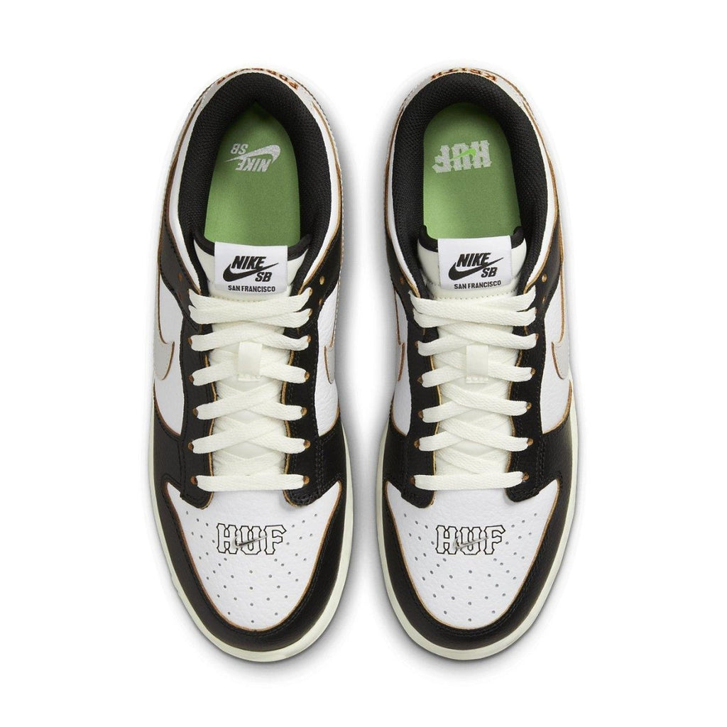 Top view of Nike SB Dunk Low HUF San Francisco sneakers featuring black and white design.
