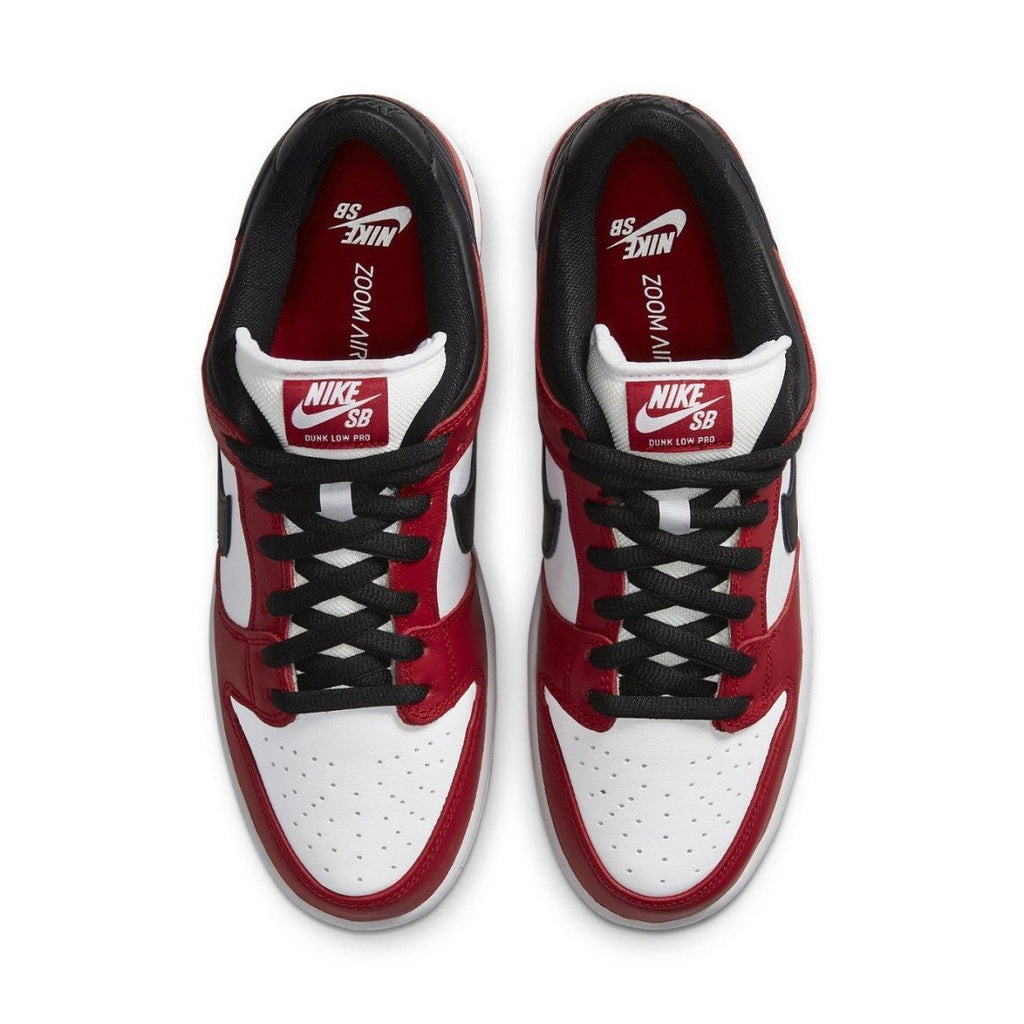 Nike SB Dunk Low J-Pack Chicago sneakers in red and white, showcasing classic design and skateboarding heritage.