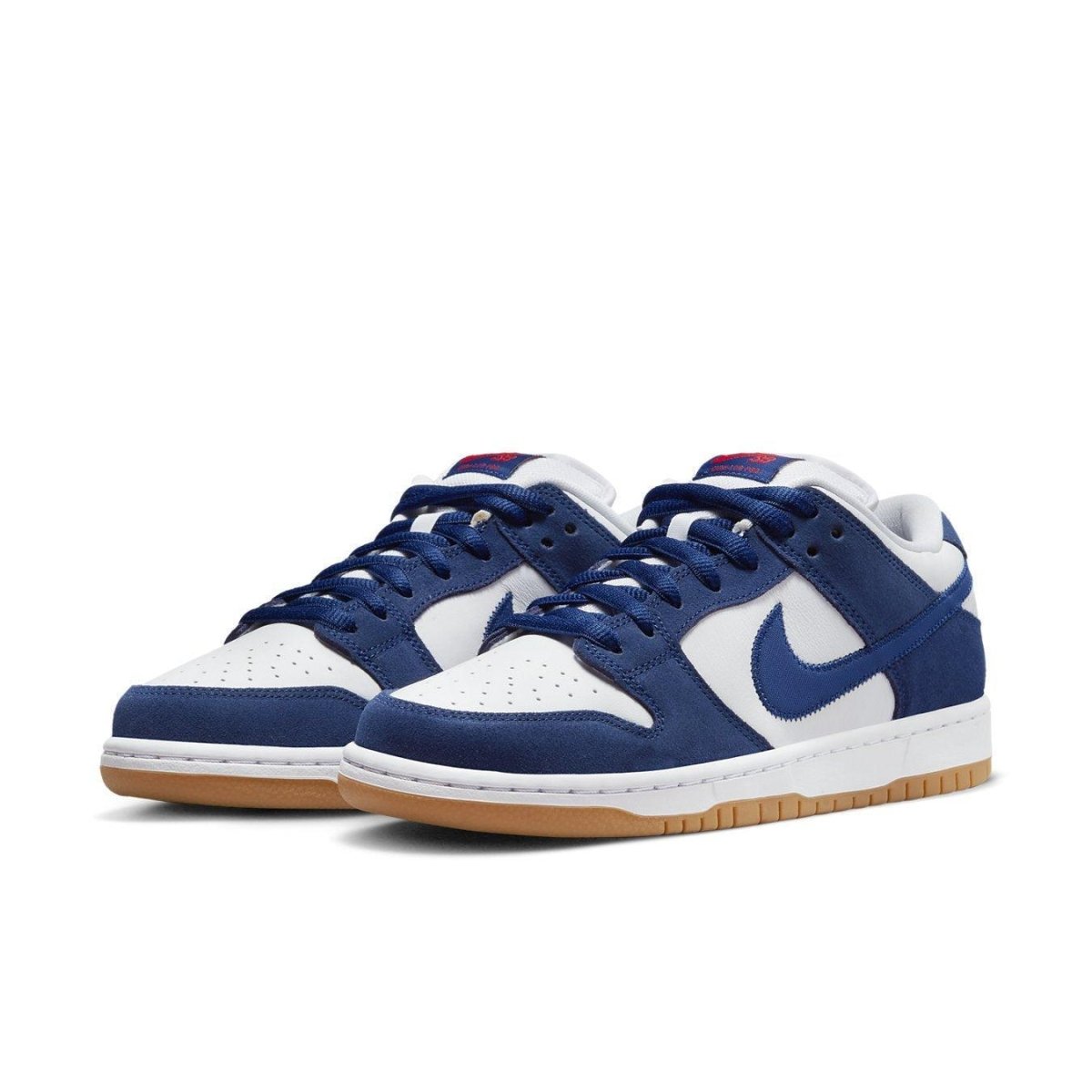 Nike SB Dunk Low Los Angeles Dodgers sneakers in Deep Royal Blue and White with Gum Light Brown sole.