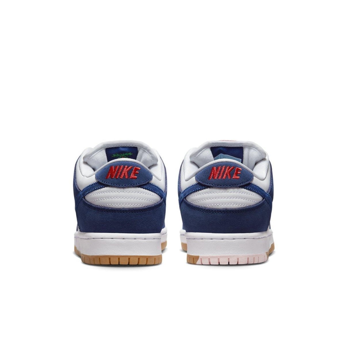 Nike SB Dunk Low Los Angeles Dodgers sneakers, featuring blue suede and white leather with red branding on the heel.