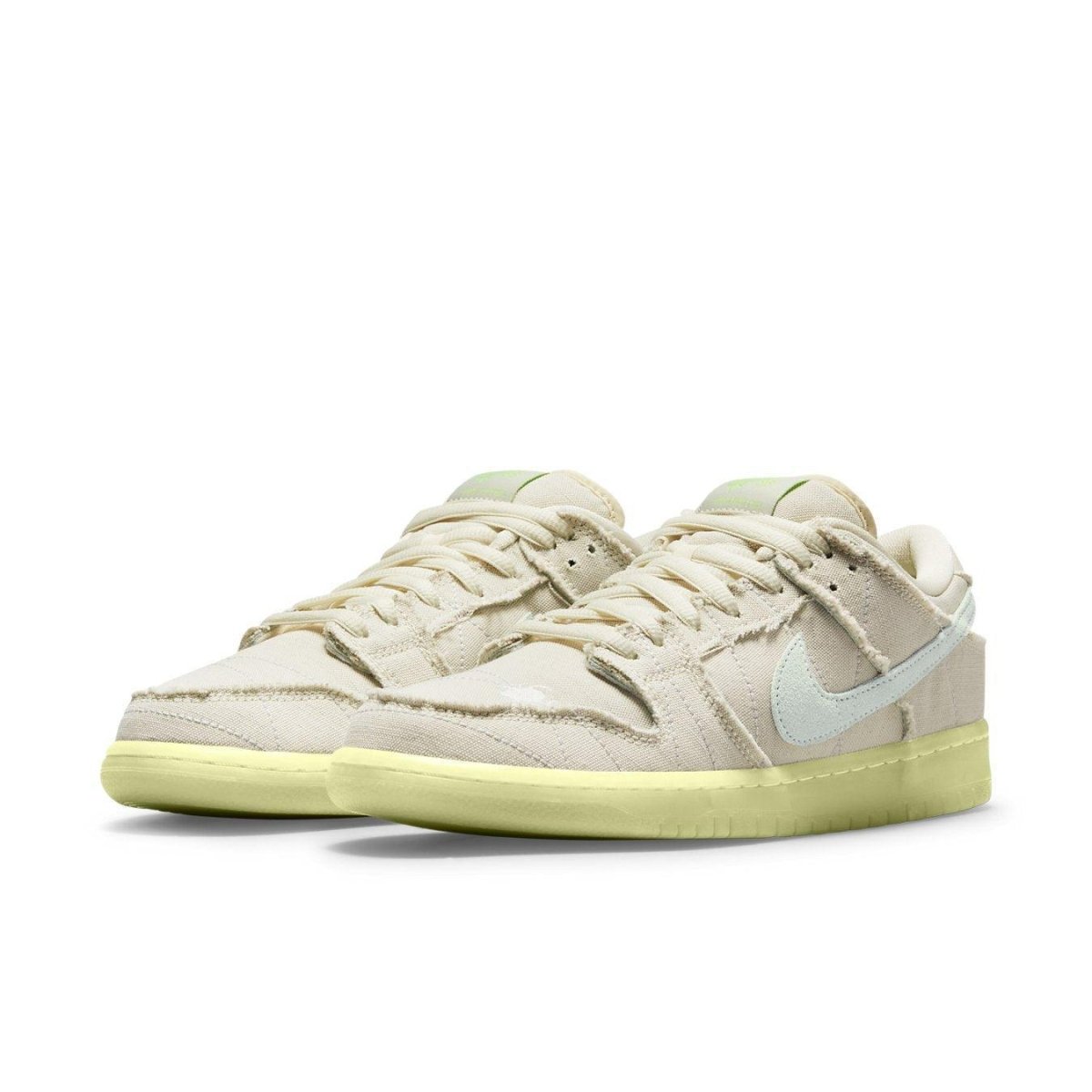 Nike SB Dunk Low Mummy sneakers with white canvas upper and glow-in-the-dark outsole for Halloween style.