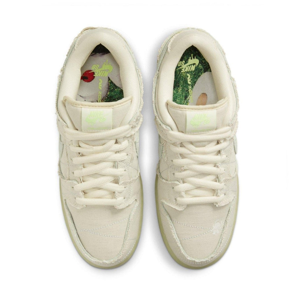 Nike SB Dunk Low 'Mummy' Halloween sneaker in white canvas with unique stitching and glow-in-the-dark sole.