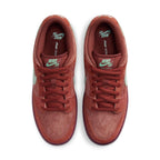 Nike SB Dunk Low Mystic Red sneakers featuring a vibrant red suede upper and 'Emerald Rise' accents.