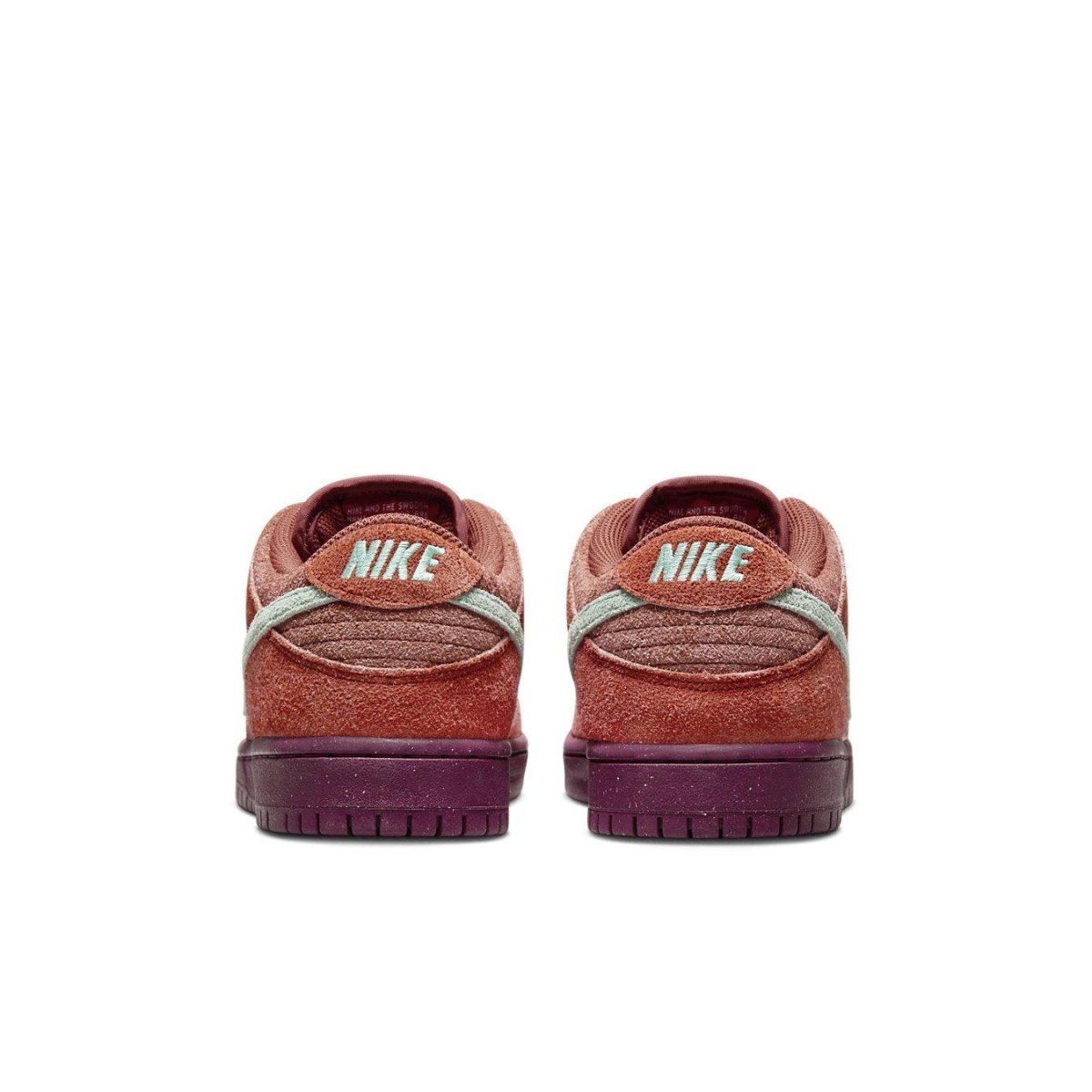 Rear view of Nike SB Dunk Low Mystic Red with Emerald Rise accents and logo detailing.