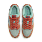 Nike SB Dunk Low Orange Emerald Rise top view showcasing suede materials and vibrant orange and emerald colorway.