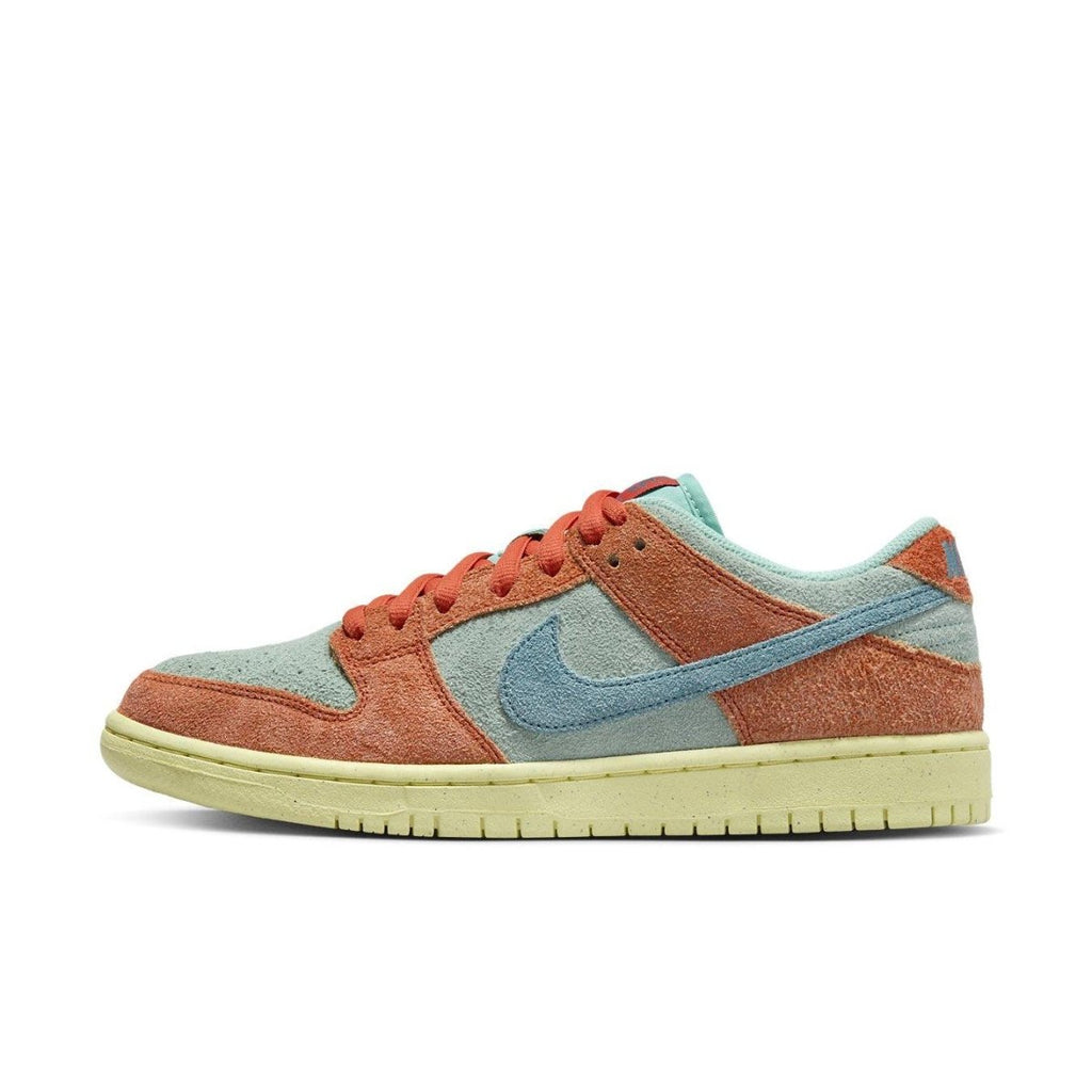 Nike SB Dunk Low Orange Emerald Rise features soft suede in emerald and orange, showcasing a classic design.