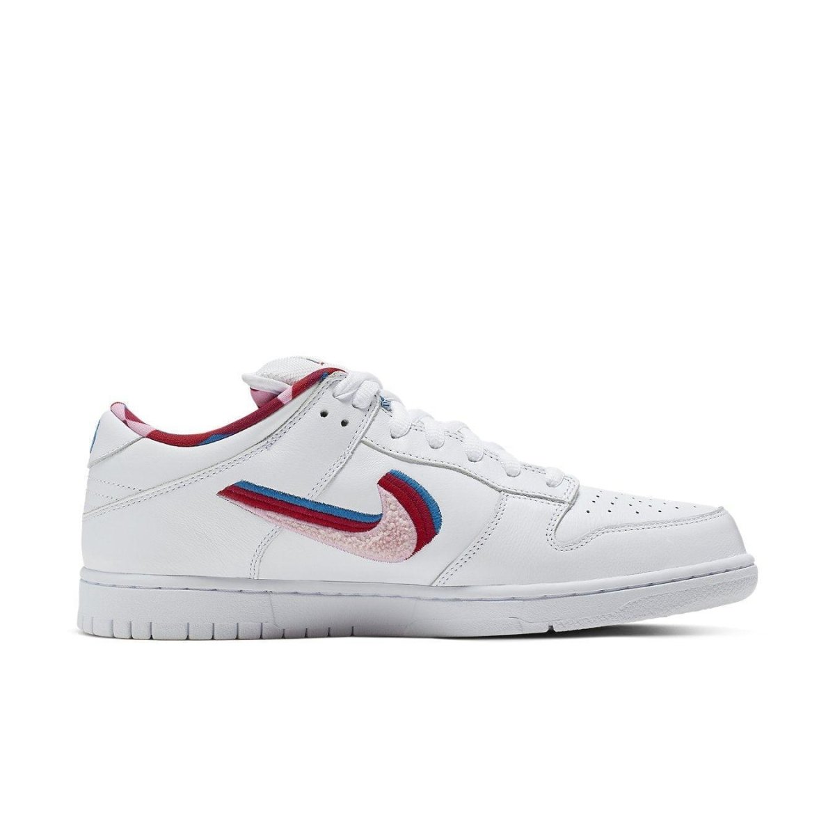 Nike SB Dunk Low Parra sneaker in white with colorful Swooshes in pink, red, and blue.