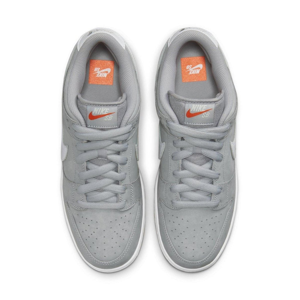 Nike SB Dunk Low Pro ISO Wolf Grey Gum sneaker in grey and orange, featuring a sleek design and classic Swoosh detailing.