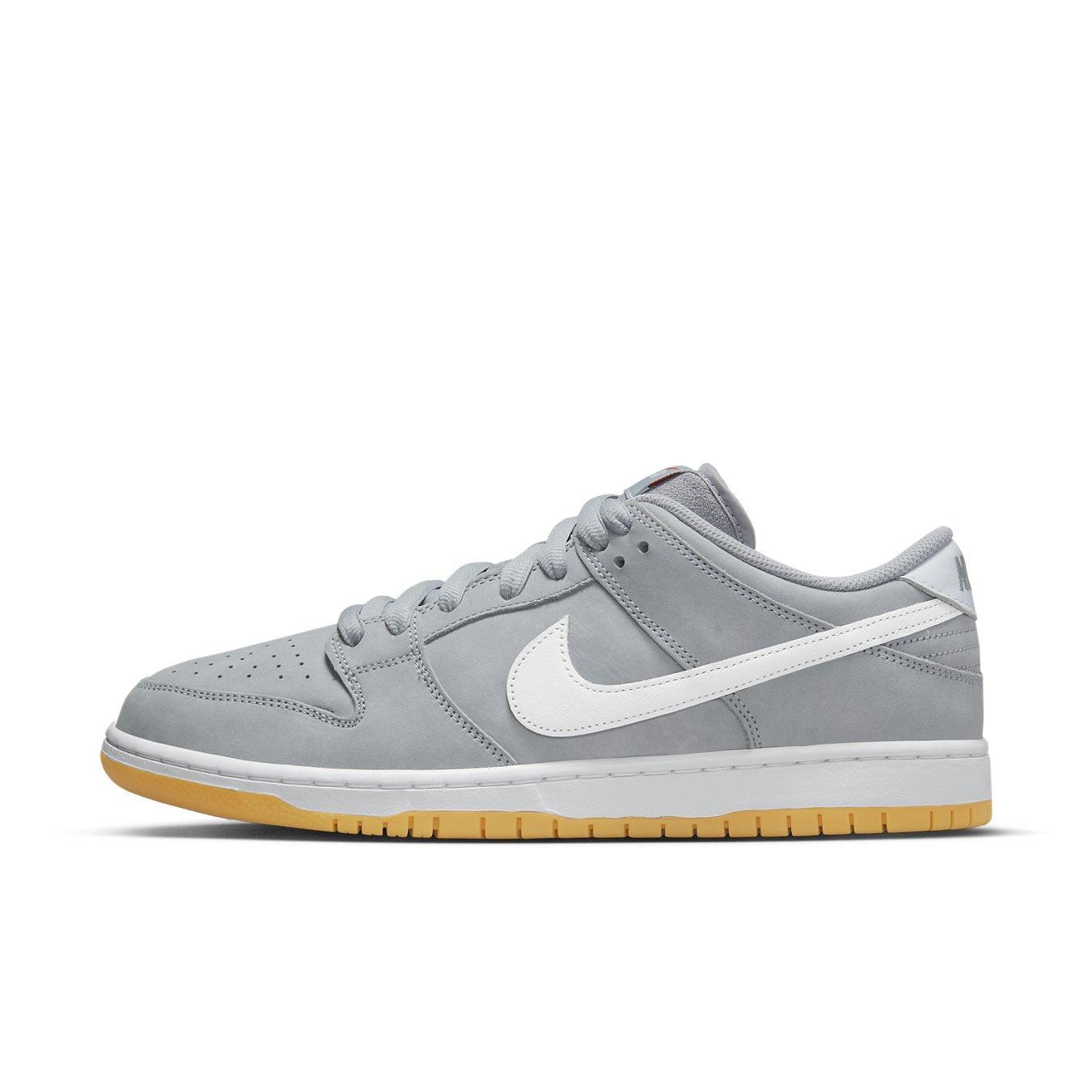 Nike SB Dunk Low Pro ISO in Wolf Grey with white Swoosh and gum sole for a sleek, retro vibe.