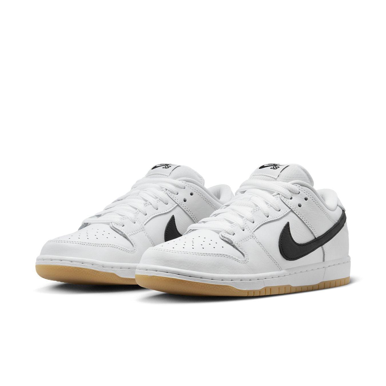 Nike SB Dunk Low Pro in white leather with black Swoosh and gum sole, offering a premium low-top sneaker style.