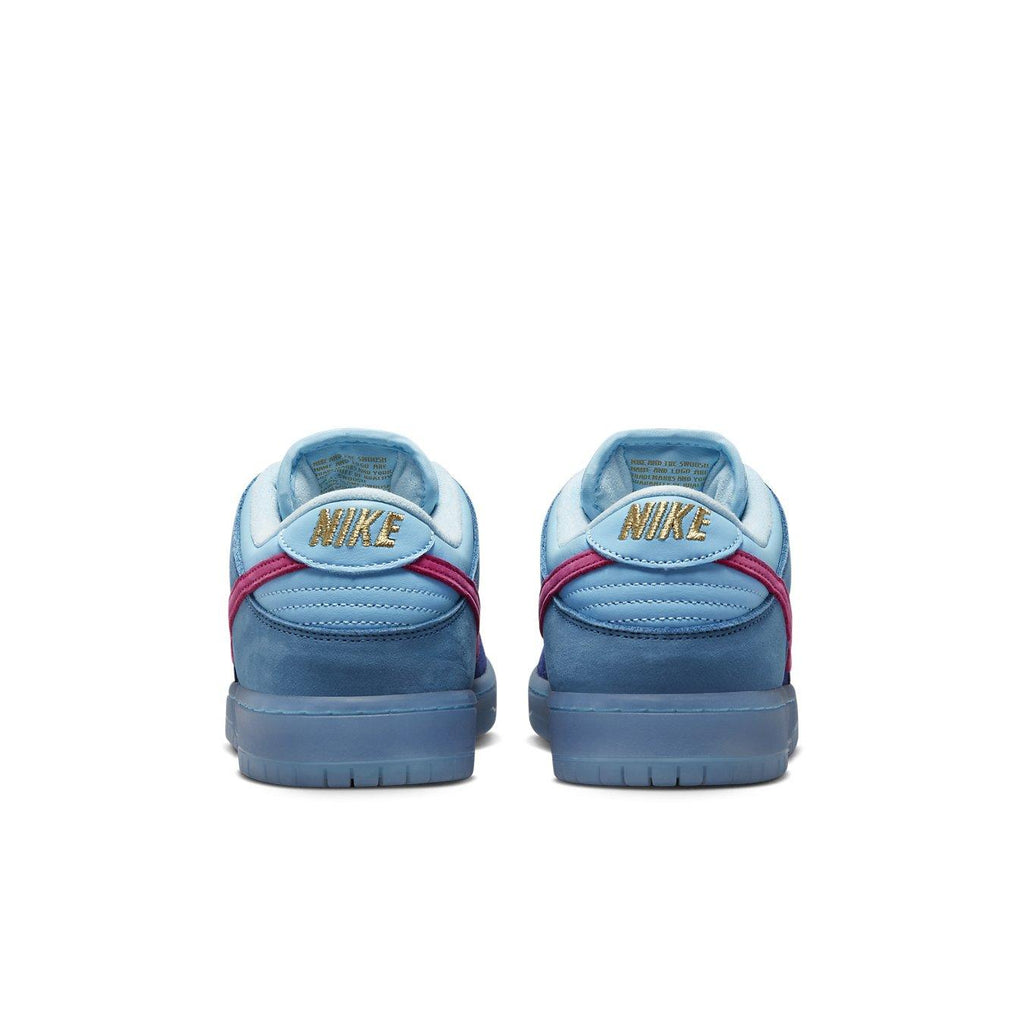 Nike SB Dunk Low Run The Jewels sneaker heel view featuring blue suede upper and metallic gold Nike branding.