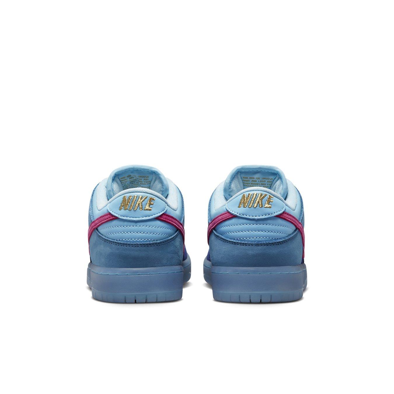 Nike SB Dunk Low Run The Jewels sneaker heel view featuring blue suede upper and metallic gold Nike branding.