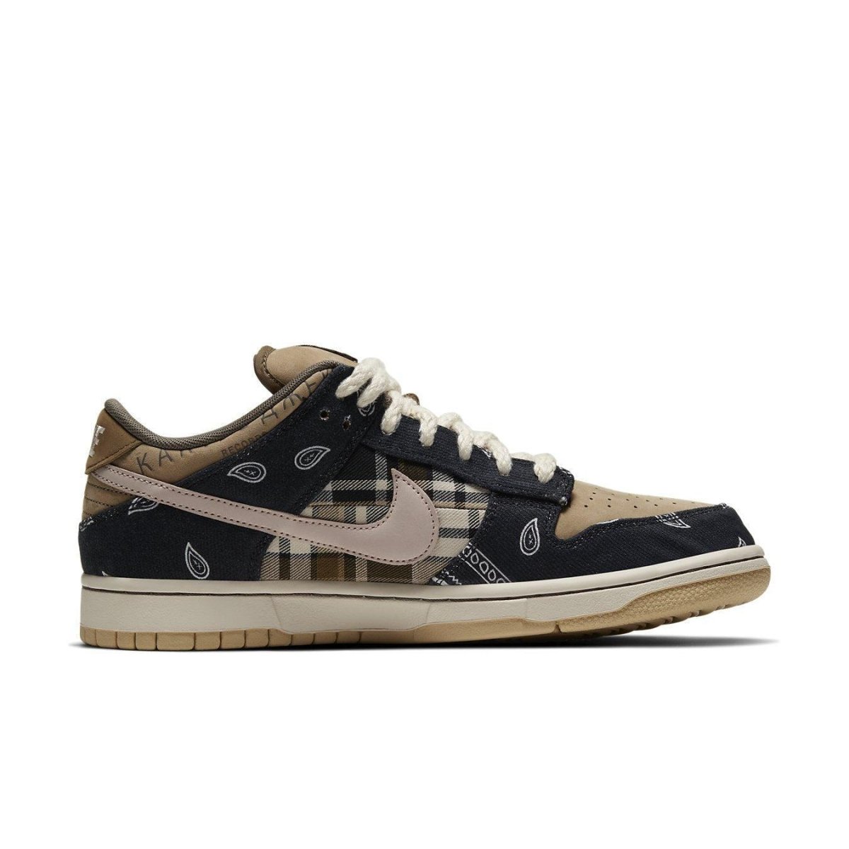 Nike SB Dunk Low Travis Scott with patchwork upper, plaid panels, and paisley overlays in brown and navy.