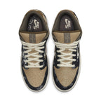 Nike SB Dunk Low Travis Scott with patchwork design, brown leather, paisley overlays, and contrasting laces.