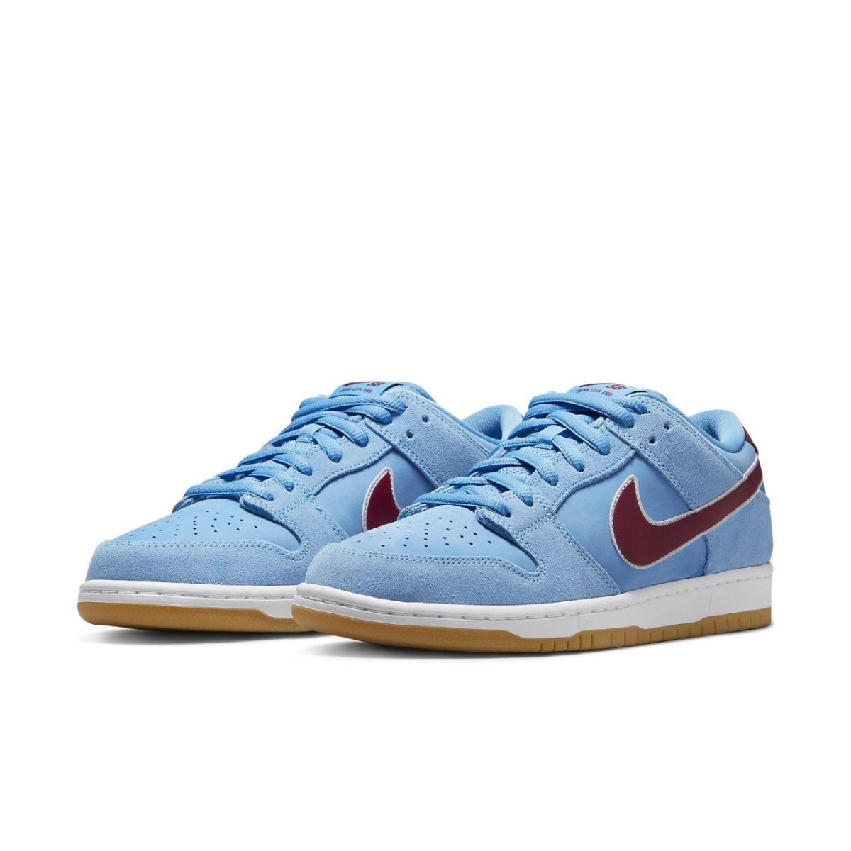 Nike SB Dunk Low in Valor Blue and Team Maroon with gum sole, offering stylish comfort and baseball inspiration.