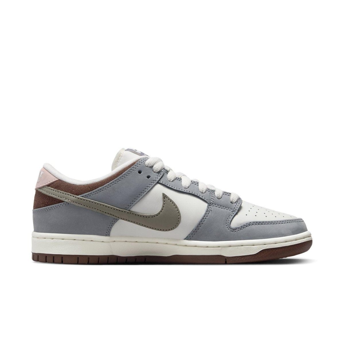 Nike SB Dunk Low Yuto Horigome sneakers in white leather and grey suede with a signature Swoosh.