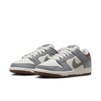 Nike SB Dunk Low Yuto Horigome featuring white leather and gray suede details.