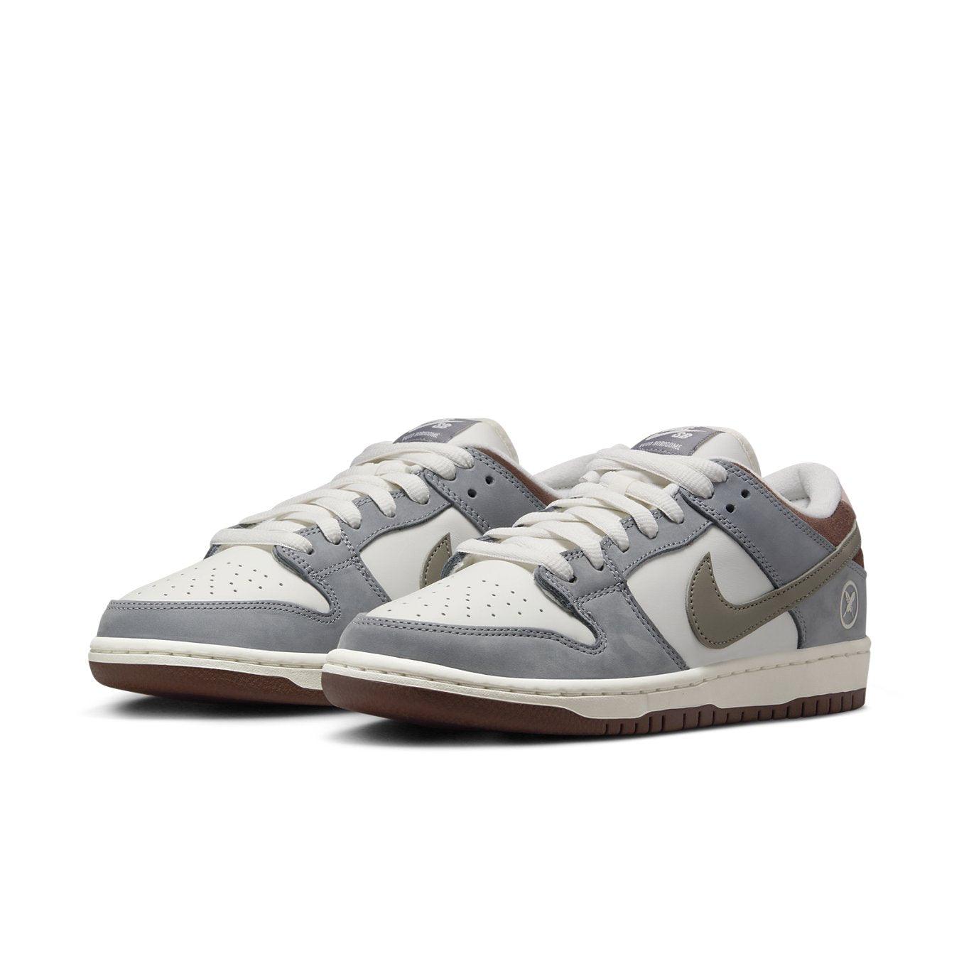Nike SB Dunk Low Yuto Horigome featuring white leather and gray suede details.