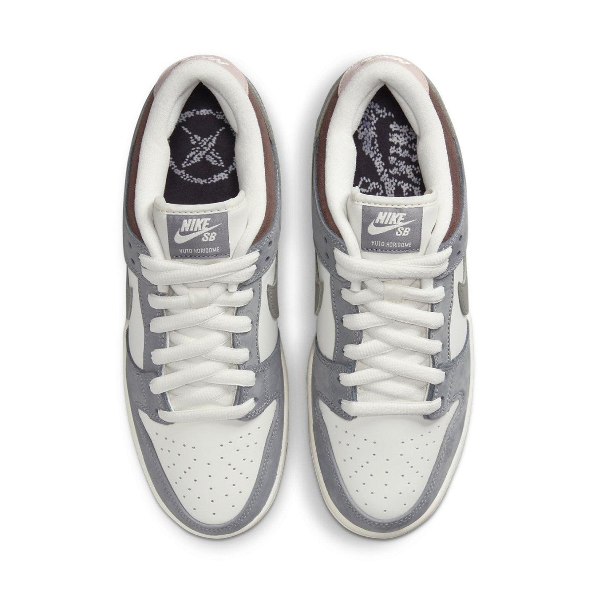 Nike SB Dunk Low Yuto Horigome sneakers with white and gray suede details, top view angle.