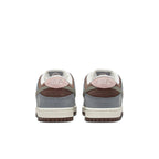 Nike SB Dunk Low Yuto Horigome sneakers featuring gray and pink accents on the heel and a classic silhouette.