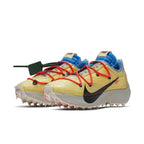 Nike Vapor Street Off-White in Tour Yellow with black Swoosh and red laces, designed by Virgil Abloh for women.