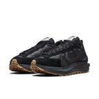Nike Vaporwaffle sacai Black Gum sneakers featuring a black nylon upper, suede and leather accents, and gum sole.