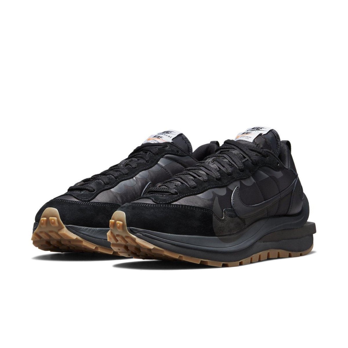 Nike Vaporwaffle sacai Black Gum sneakers featuring a black nylon upper, suede and leather accents, and gum sole.