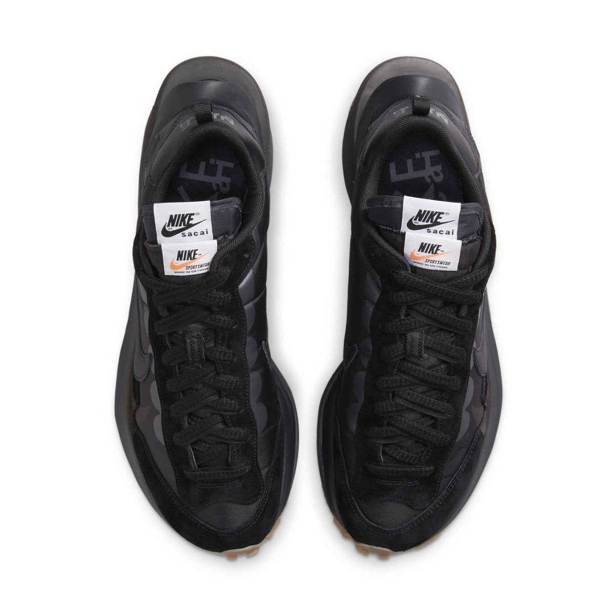 Top view of Nike Vaporwaffle sacai Black Gum sneakers in black nylon and suede with double laces.